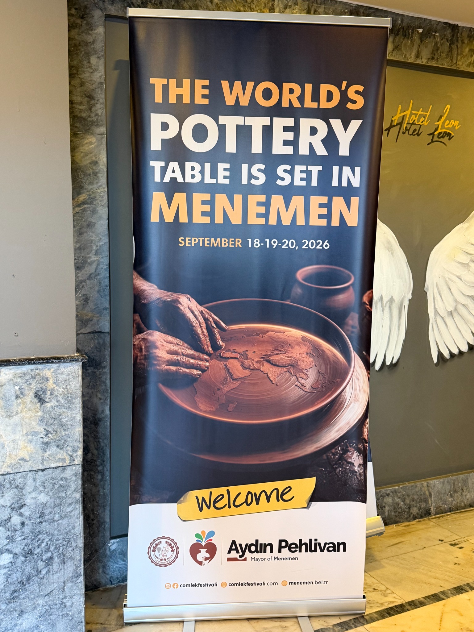 Official festival welcome banner reading The world's pottery table is set in Menemen