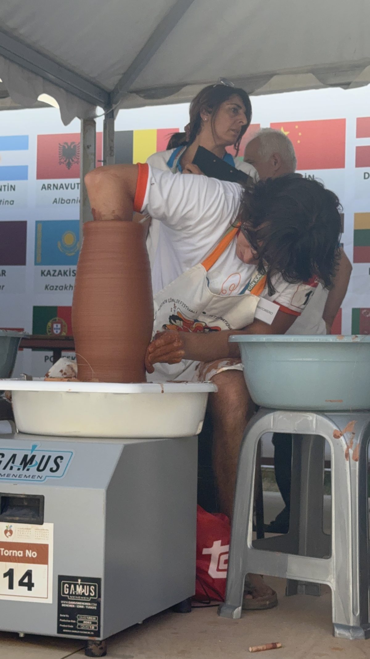 Dapo throwing a tall vessel during the Menemen pottery competition