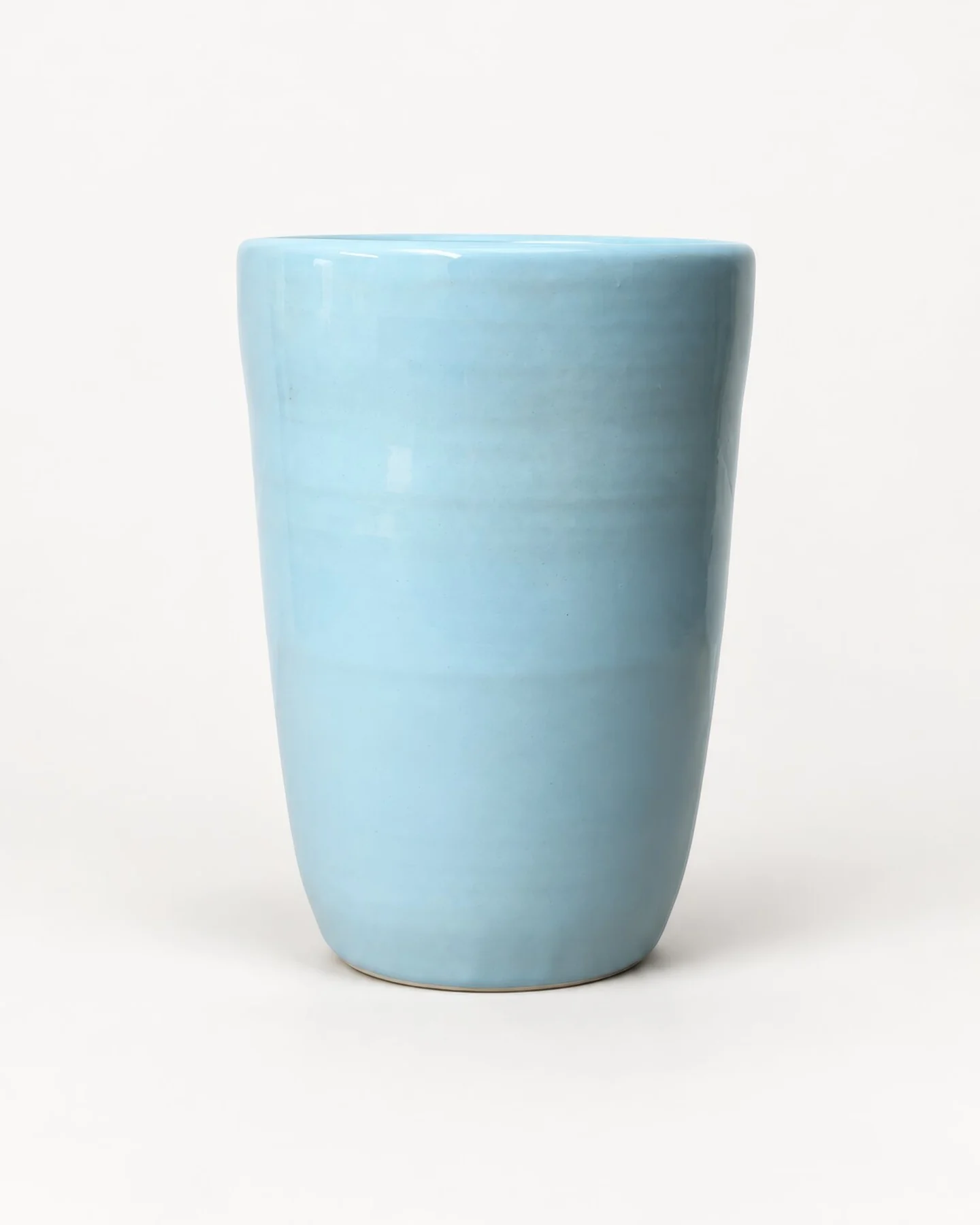 Celestino Vase, a tall wheel-thrown vase in pale blue glaze
