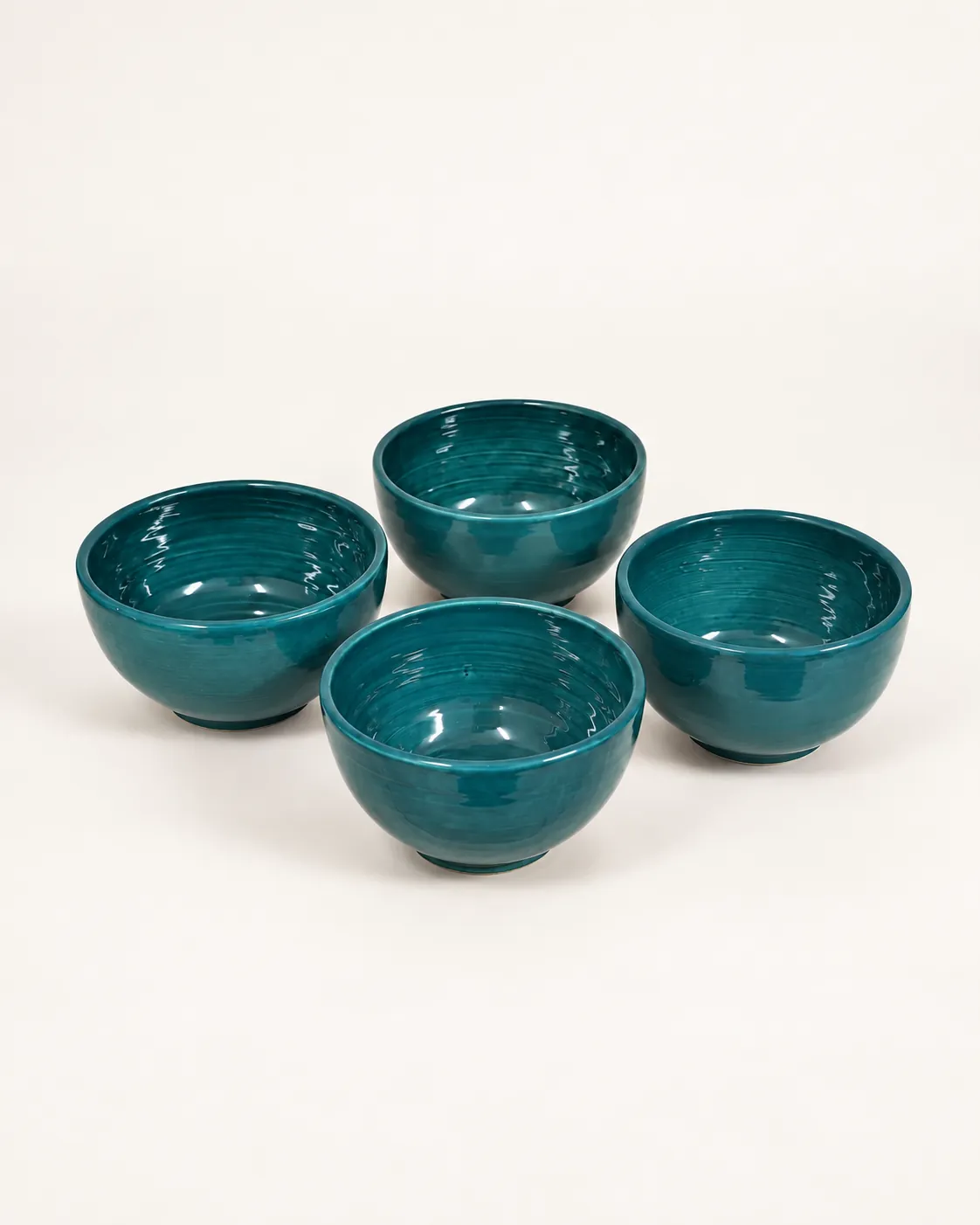 Royal Cups, four teal wheel-thrown cups