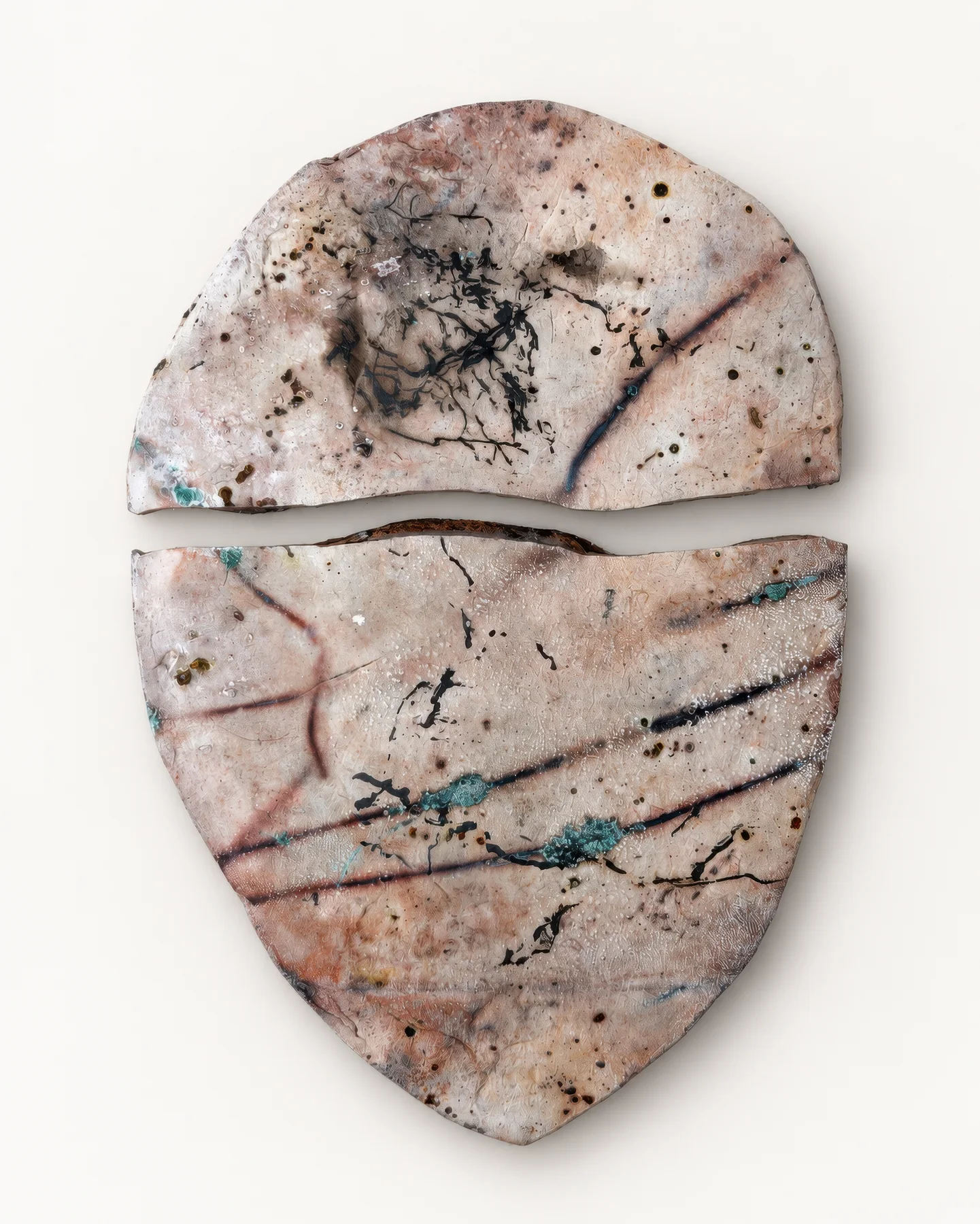 Saggar Piece 1: a ceramic slab with dark carbon marks and pale, fire-patterned surfaces.
